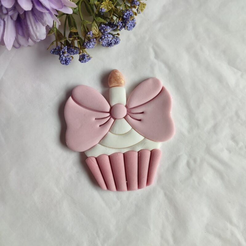 Cupcake with candle and bow