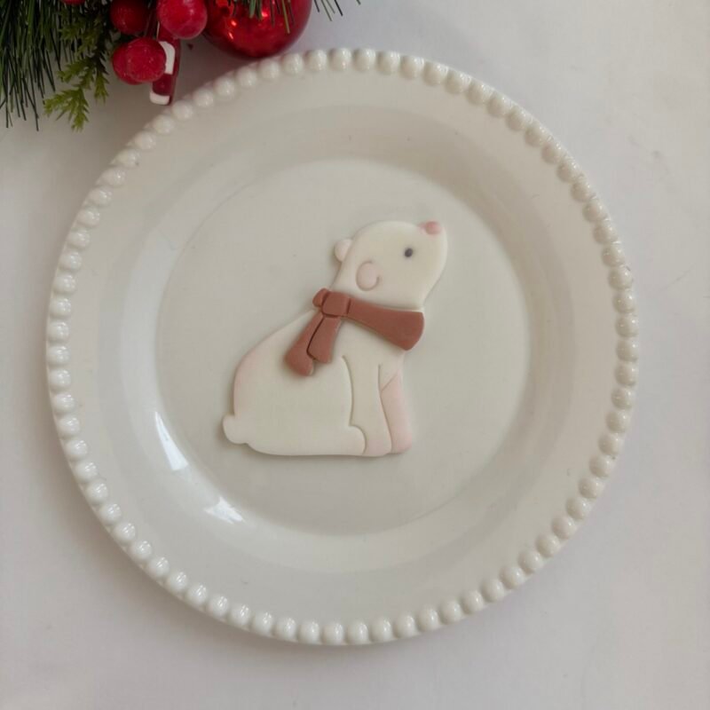 Sitting bear with scarf