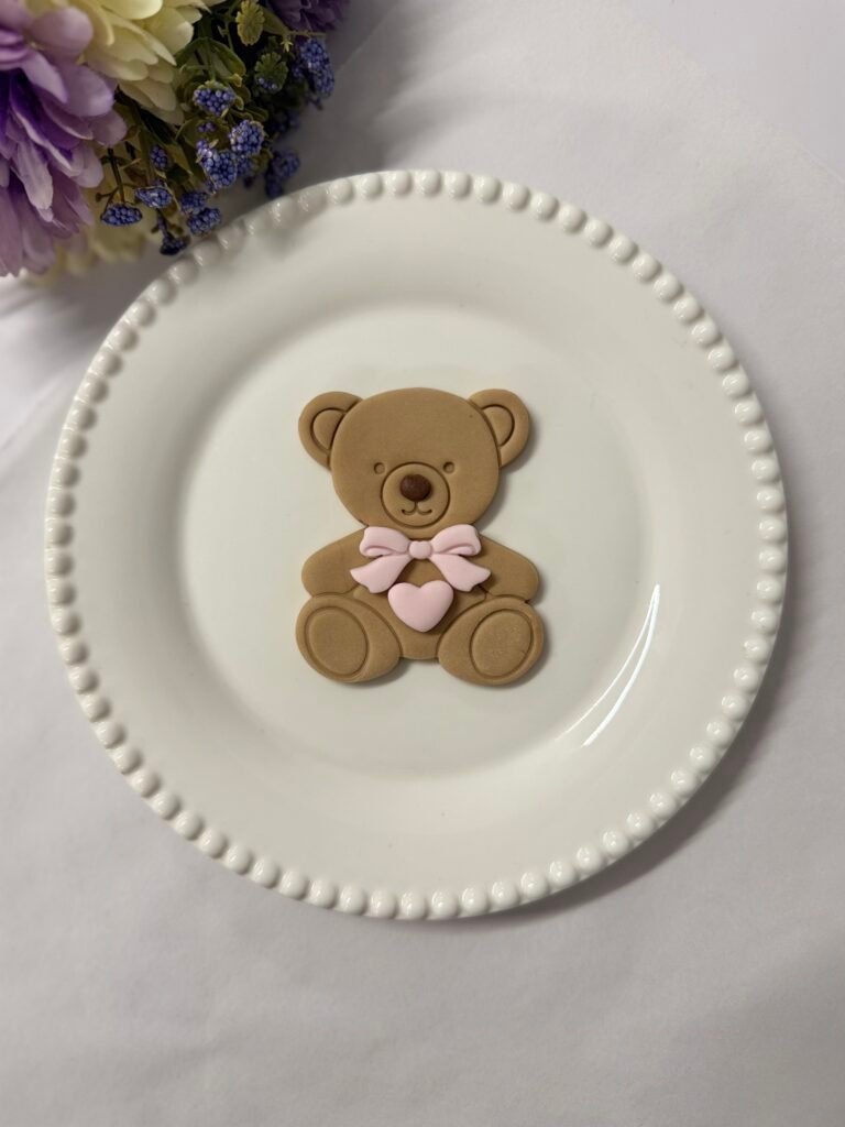 Sitting bear with bow