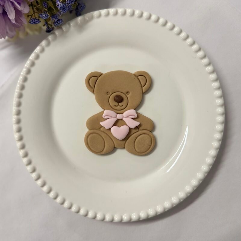 Sitting bear with bow