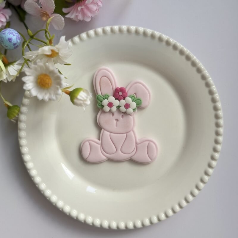 Sitting bunny with flowers